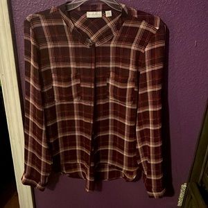 It is a New York company top size medium colors are red burgundy and white